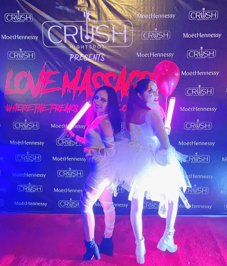 Two girls, one dressed asa clown and the other as a mummy at Crush Nightspot in Cabo, Mexico for Halloween.