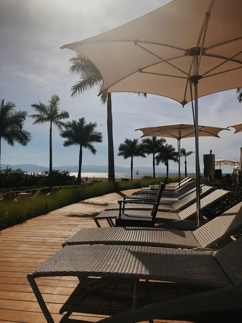 Chaises lined up next to a pool at a hotel in Puerto Vallarta in Mexico