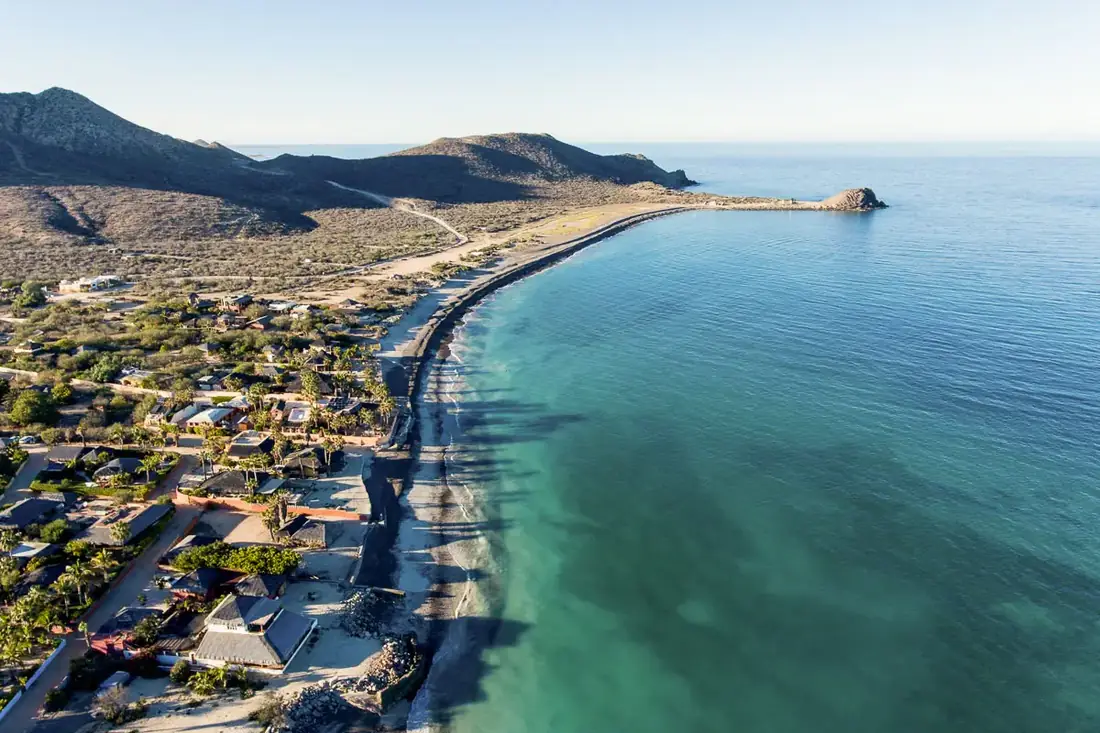 Shore of the Sea of Cortez lined with buildings. 