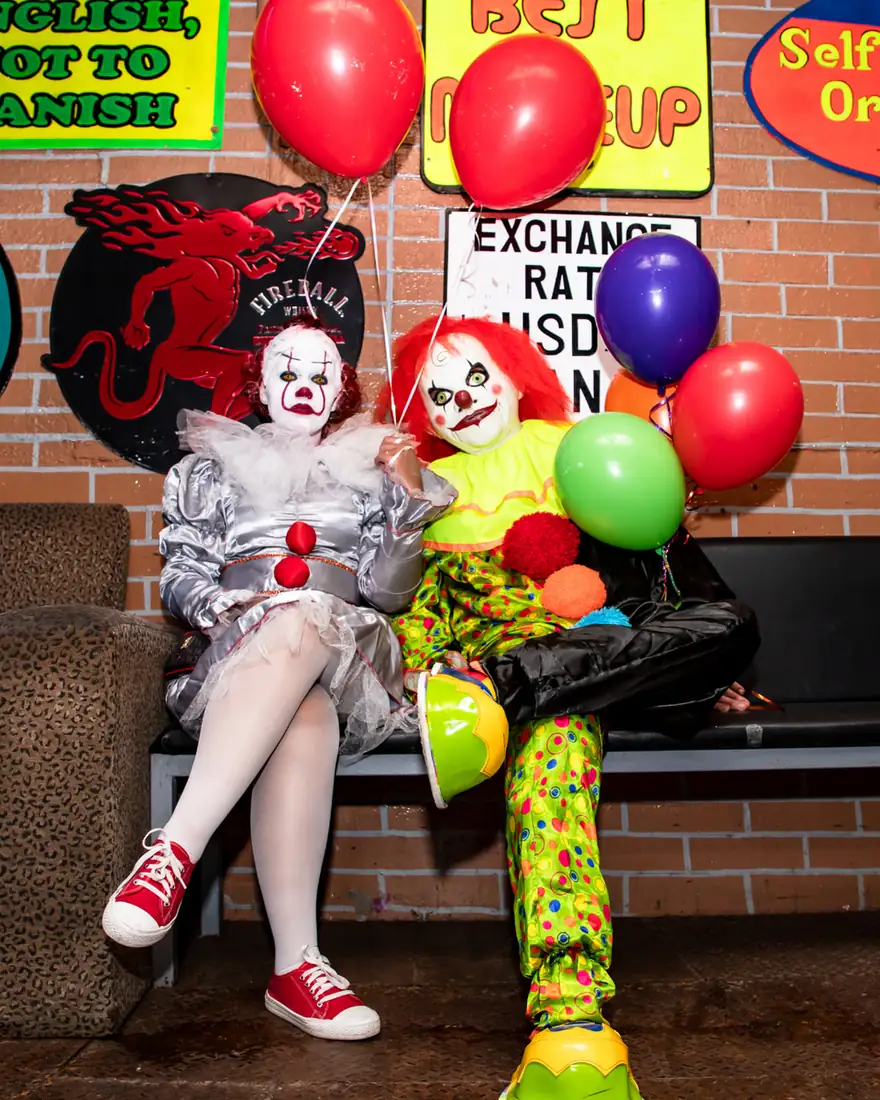 Couple dressed as clowns at El Squid Roe in Cabo, Mexico for Halloween. 
