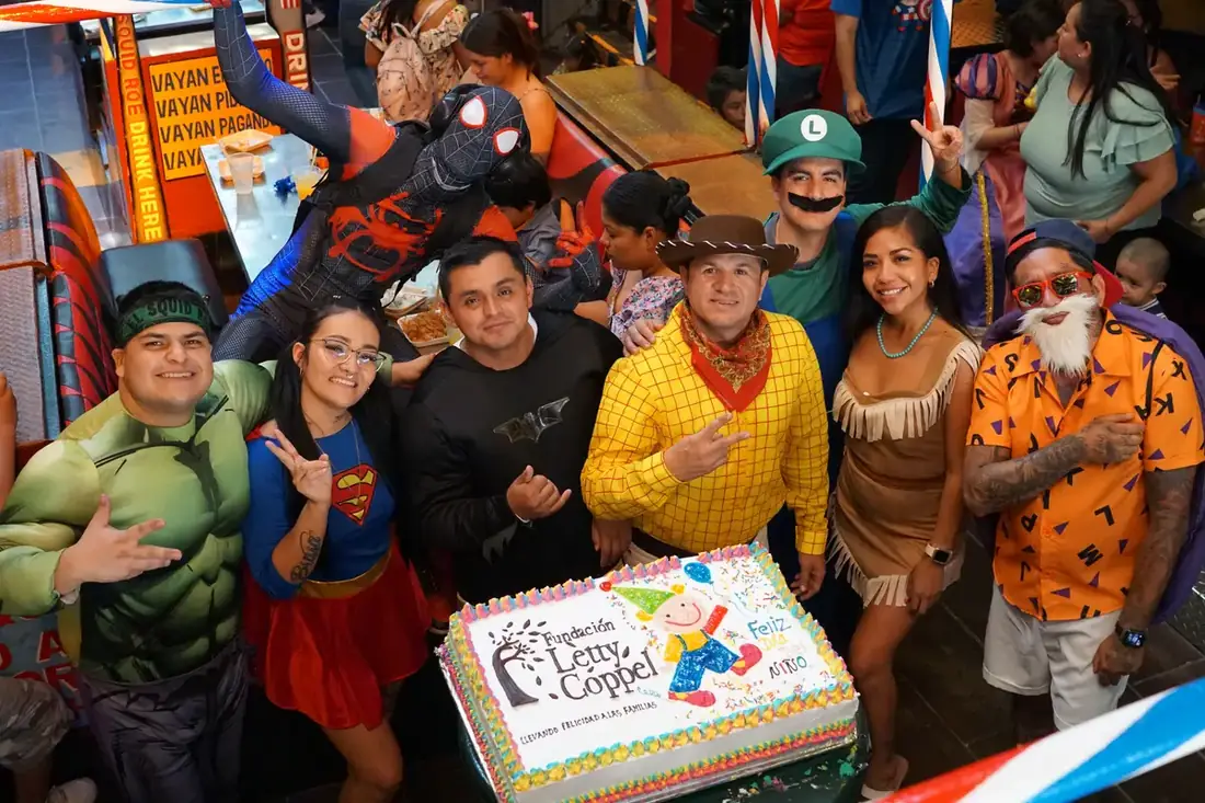 Hulk, SuperGirl, SpiderMan, Woody, Pocahontas, Luigi, and Master Roshi all around a cake.