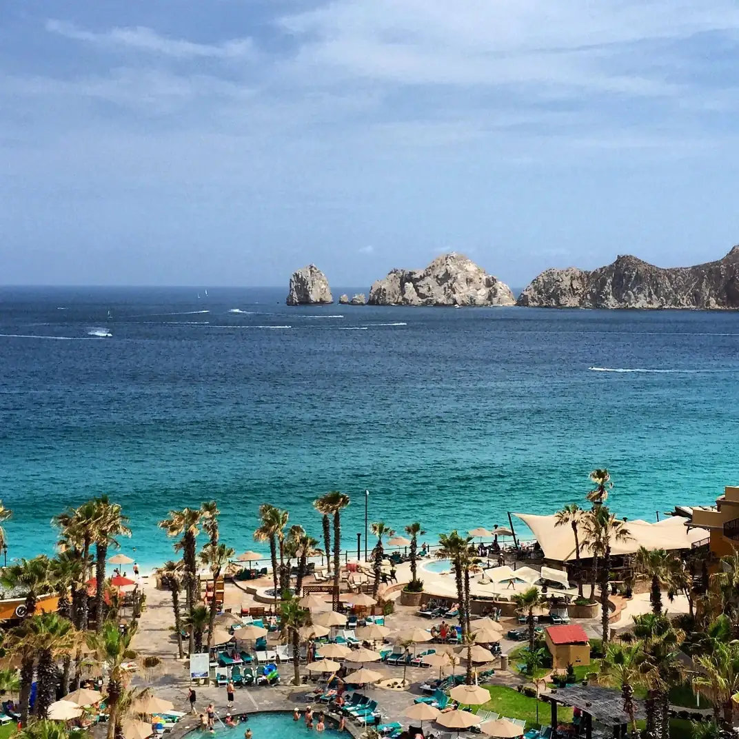 View of Medano Beach from a hotel balcony, with the Arch in the background.