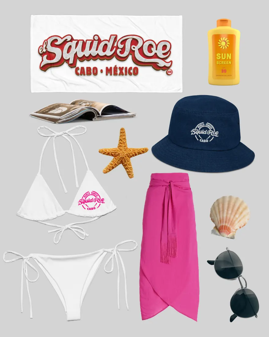 El Squid Roe beach towel, sun block, an open book, a white string bikini with pink El Squid Roe design on the right breast, starfish, denim bucket hat, pink sarong, seashell, sunglasses.