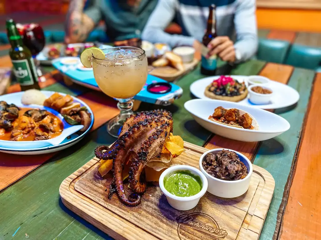 Various dishes from Wachinango's Seafood in Cabo, Mexico including Grilled Octopus, aguachile and tostadas. 