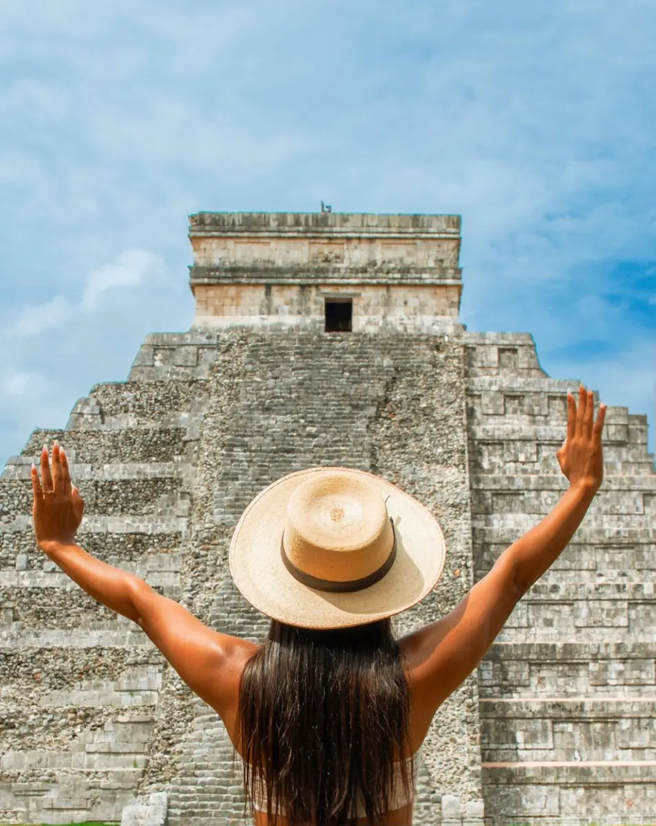 Woman posing in front of a temple in Cancun, Mexico. 