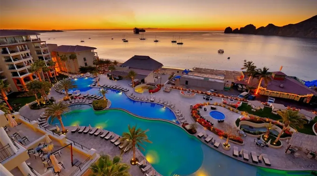 Pool and part of the hotel seen at sunset, with the Ocean of Cortez in the background. 