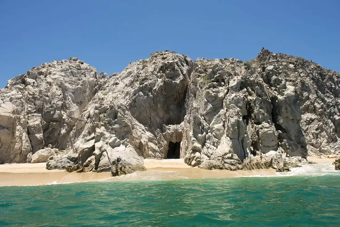 Cave hidden in rocky hills bu The Arch of Cabo.