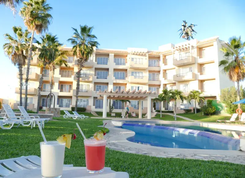Pool and hotel room balconies at El Ameyal Hotel in Cabo, Mexico. 