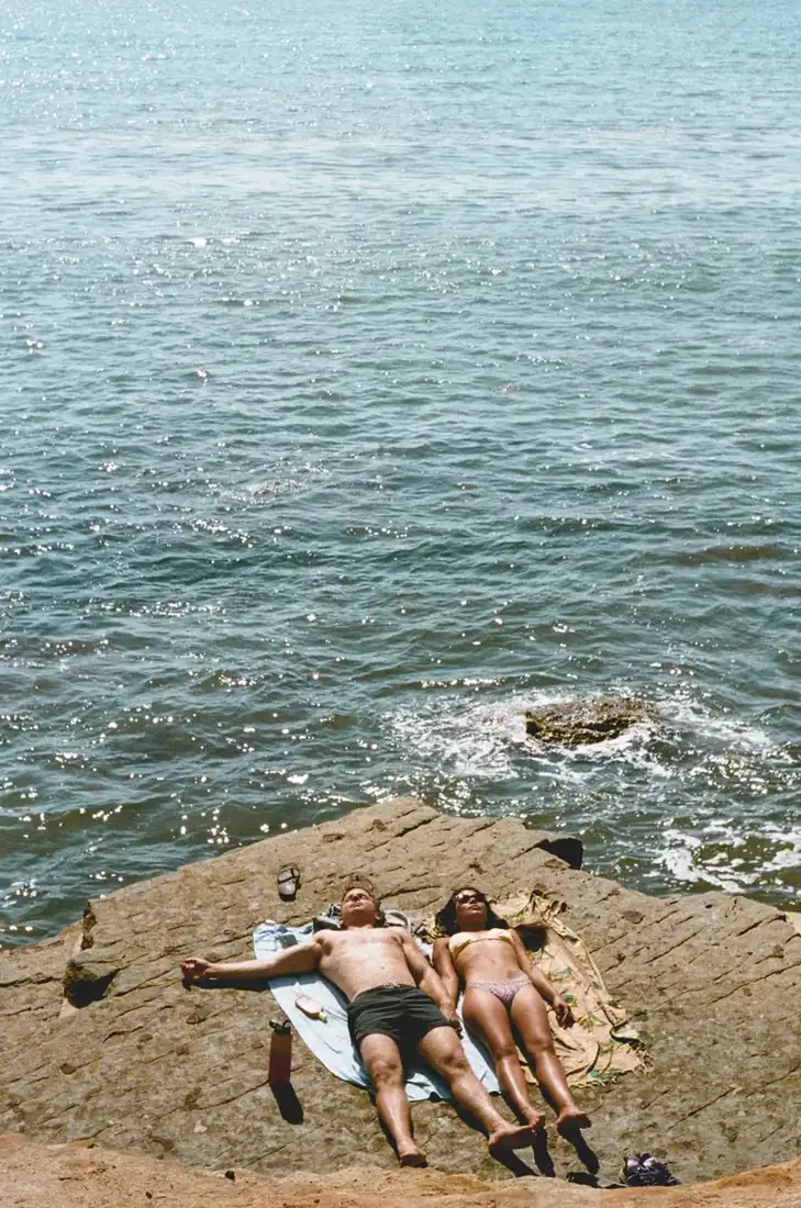 Couple relaxing by the ocean.