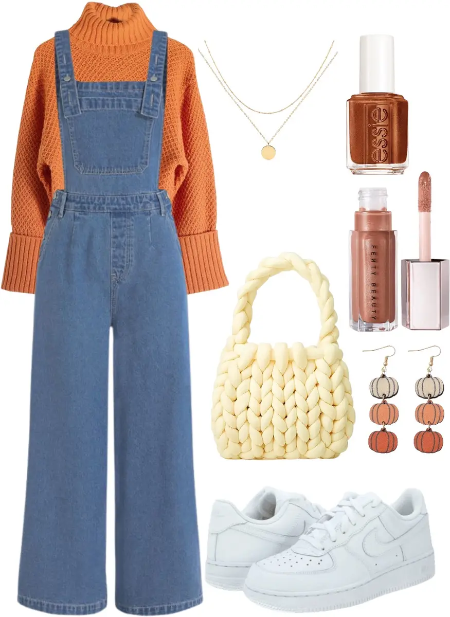 Wide legged overalls over a chunky bright orange turtleneck sweater, white sneakers, thick knit purse in off-white, layered gold jewelry, copper nail polish and lip gloss, and a pair of pumpkin earrings.