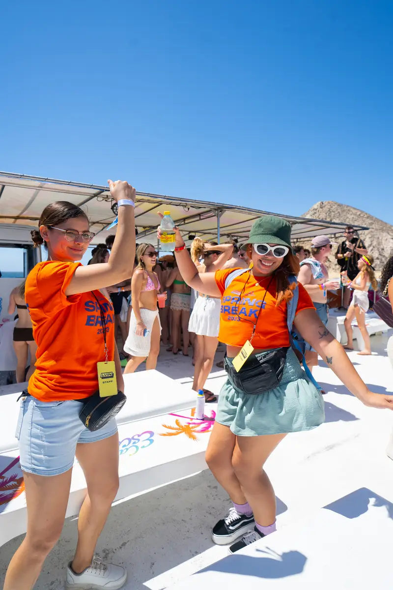 Group of people dancing on at a boat party in Cabo San Lucas, Mexico.