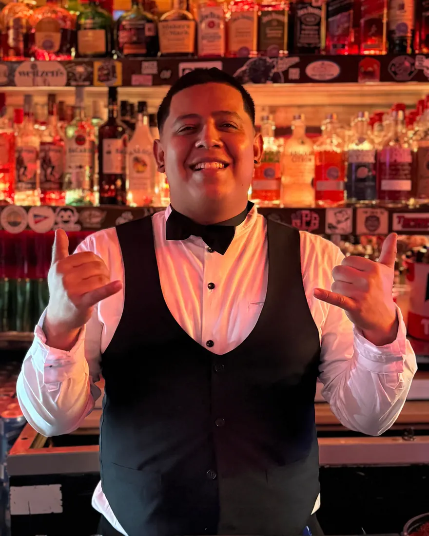 Bartender from El Squid Roe in Cabo, Mexico dressed up for New Year's Eve 2025.