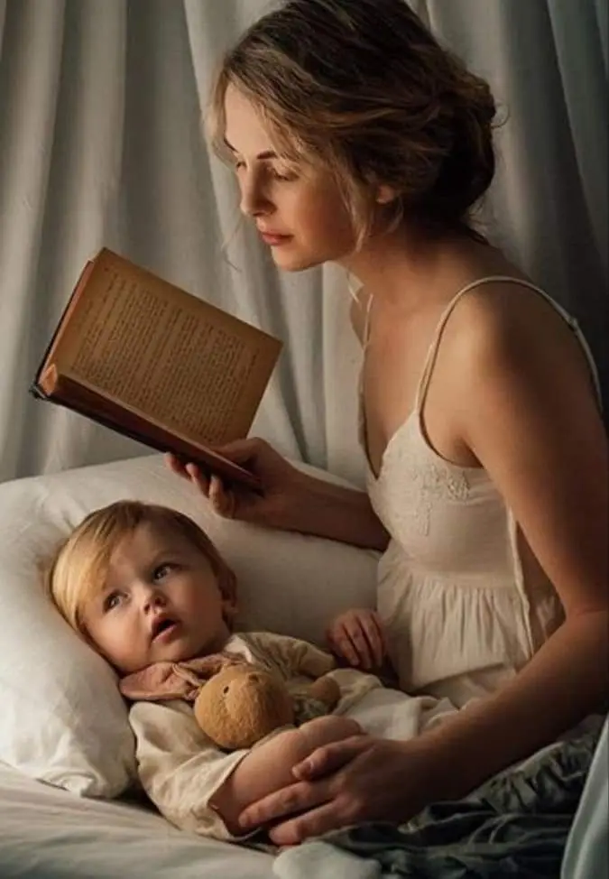 Mother reading her child a bed time story.