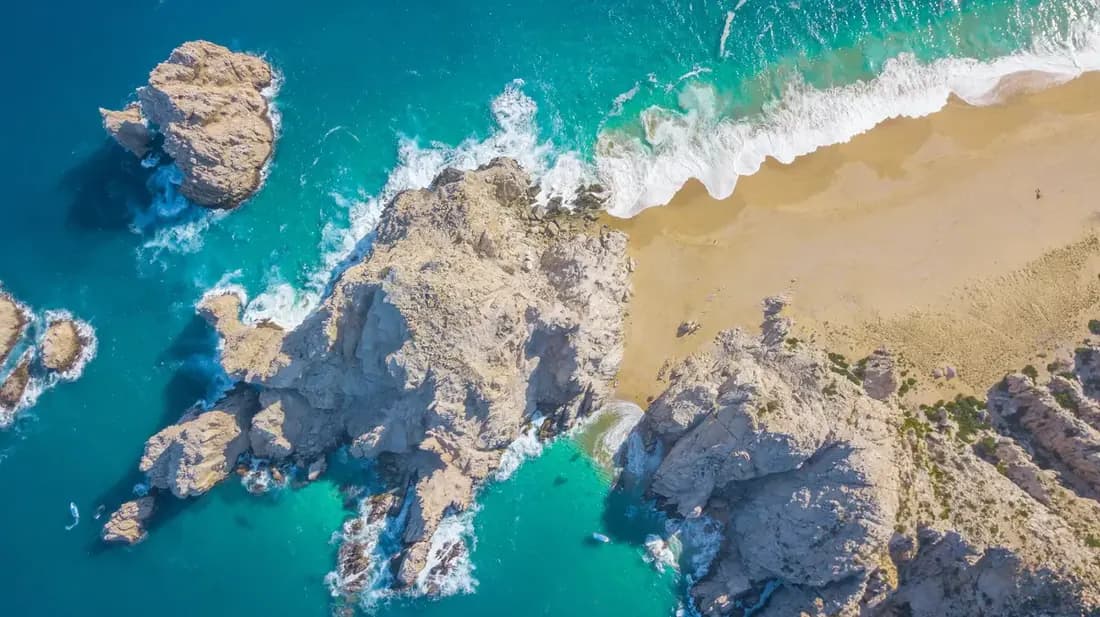 Over head shot of Lover's Beach and Divorce Beach, where you can see both the Sea of Cortez and the Pacific Ocean.
