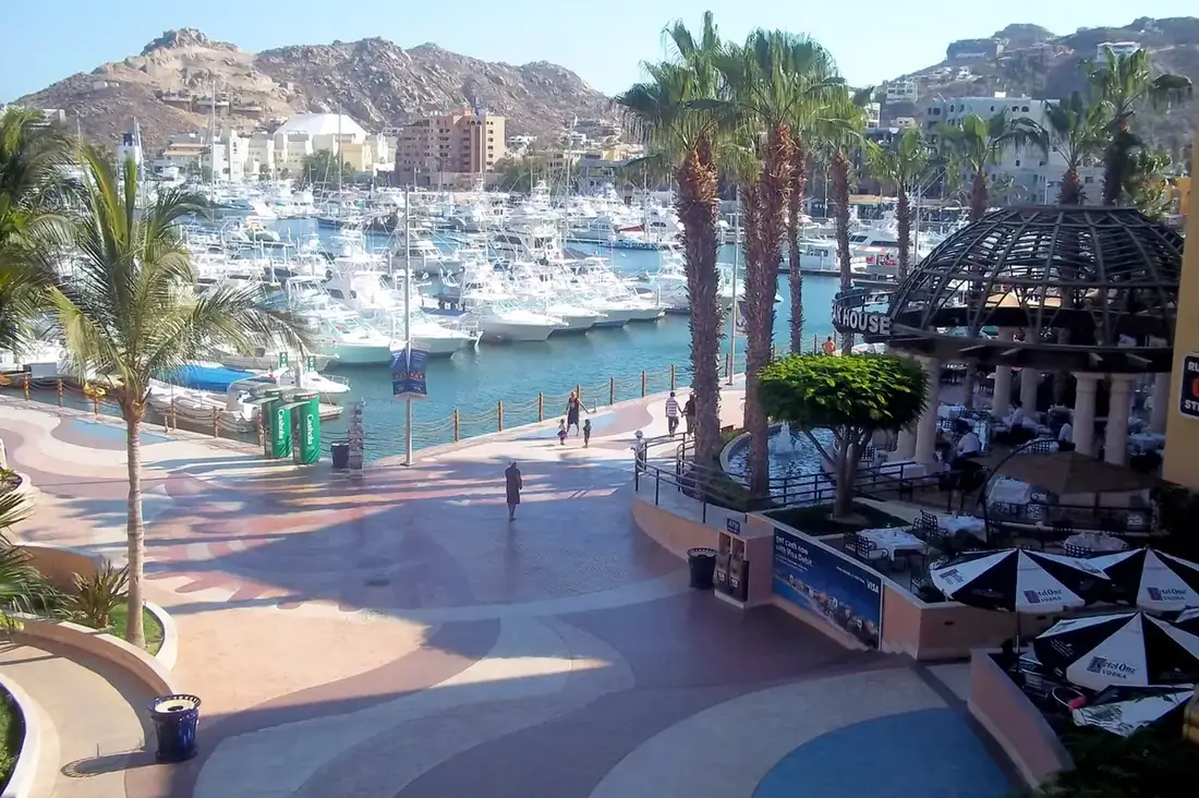 View of the marina in Cabo from the mall Puerto Paraiso, hills in the background.