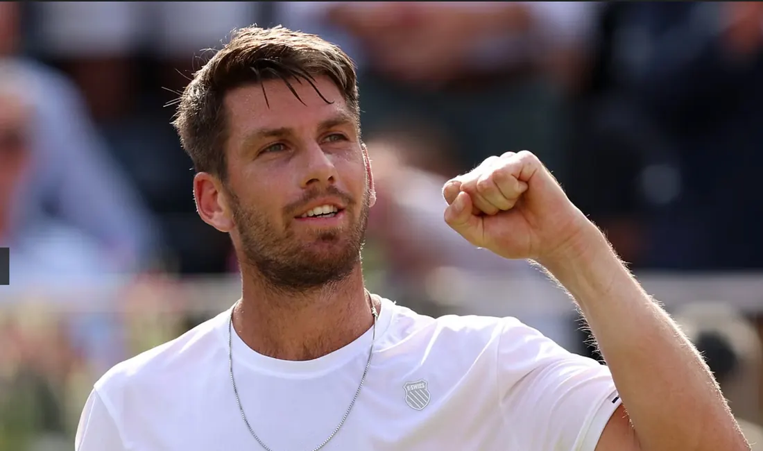 Cameron Norrie celebrating a win with his fist in the air.