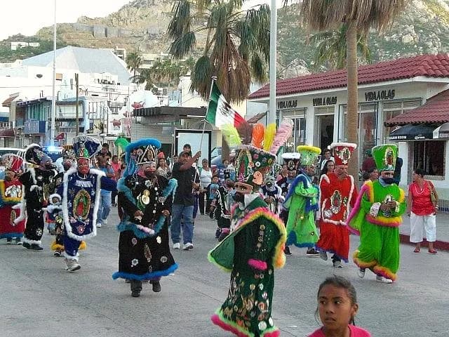 Parade in the streets of Cabo San Lucas, people in traditional clothes.