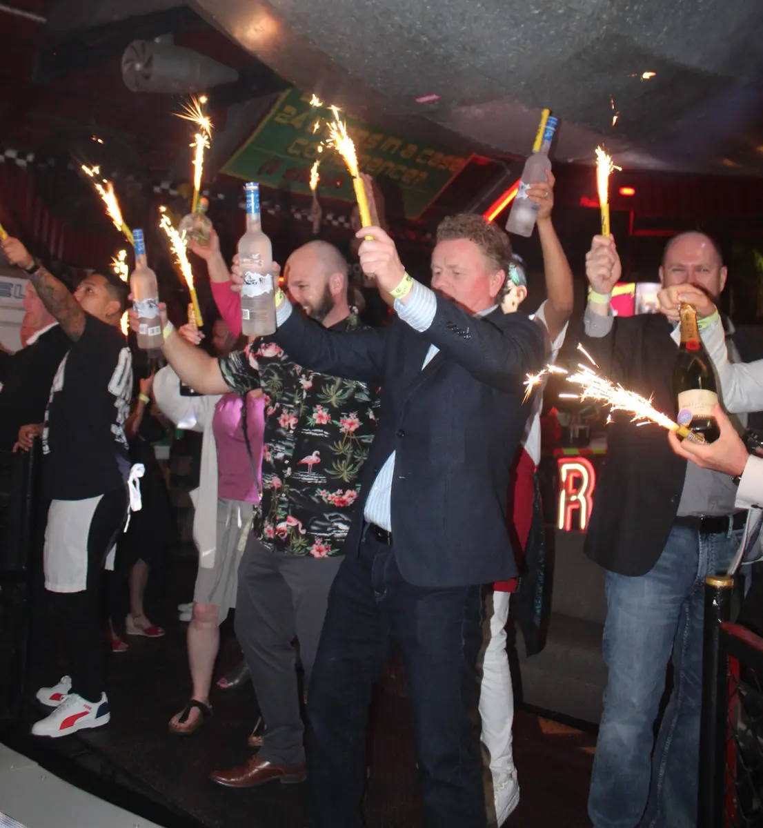 People celebrating the Fourth of July with bottle service at El Squid Roe.