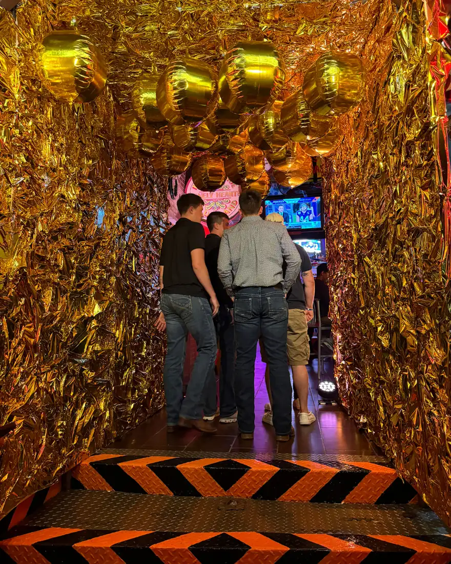 Patrons entering El Squid Roe in Cabo, Mexico decorated for New Year's Eve 2025.