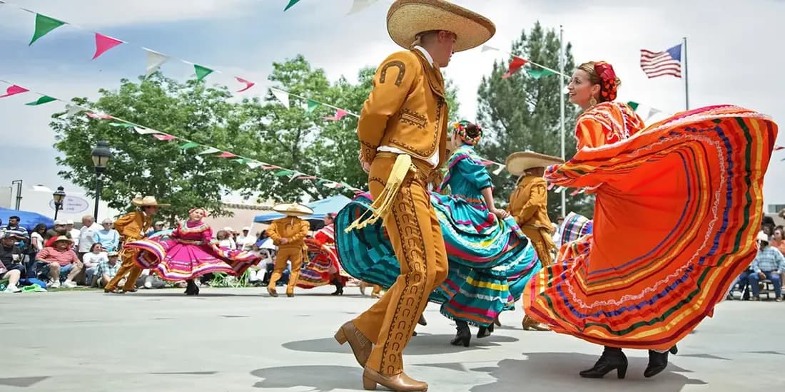 Parade of dancing couples for 5 de Mayo.